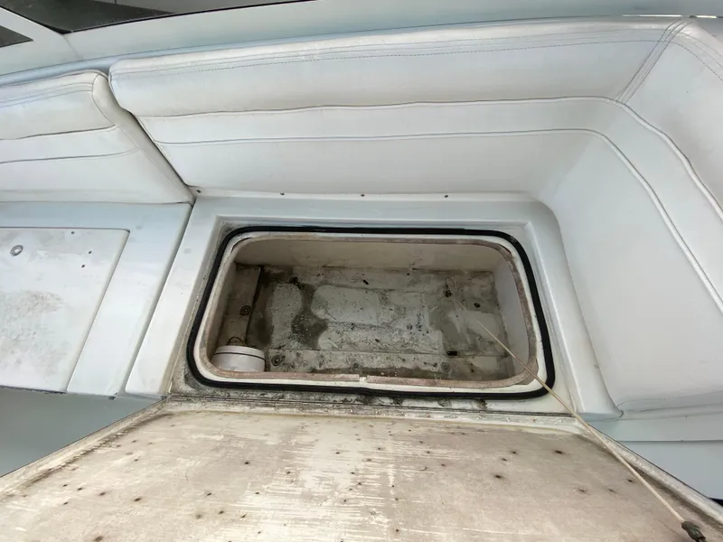 Slide: The Image of Open storage compartment on 1998 Contender 35 Express boat. - 35