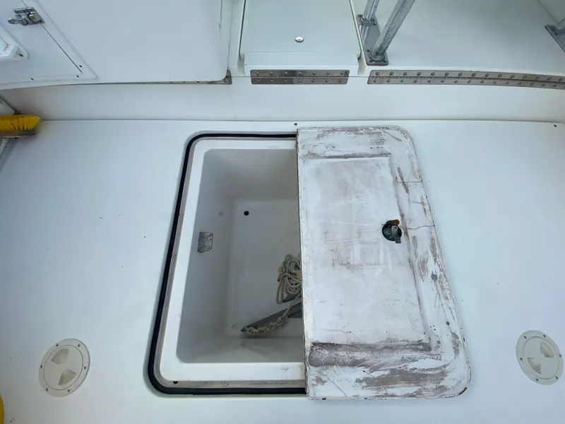 Slide: The Image of Open storage compartment on 1998 Contender 35 Express boat deck. - 9