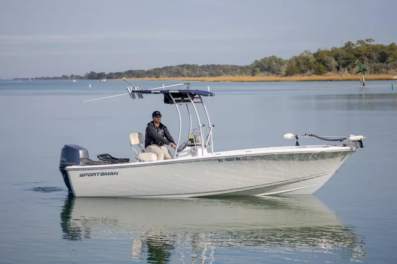 Slide: The Image of 2017 Sportsman Island Reef 19 Center Console boat on calm water. - 3