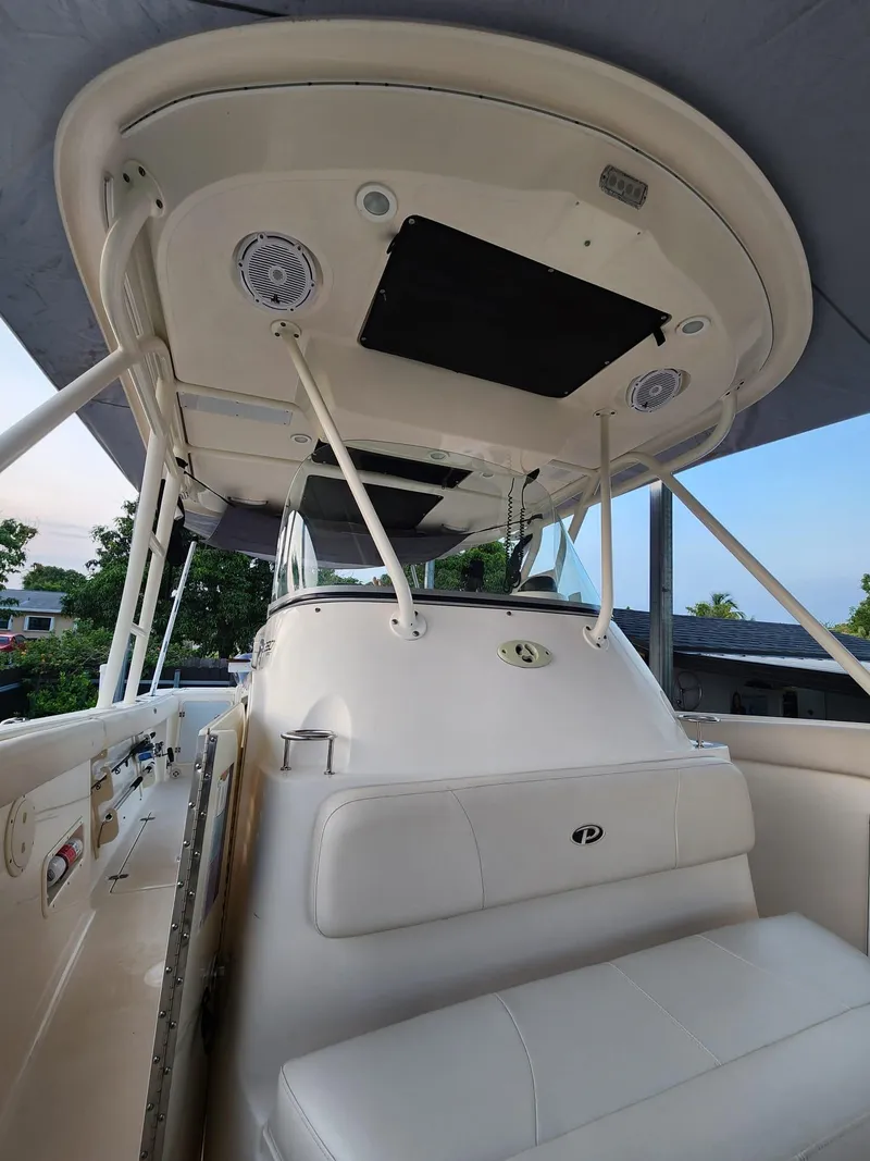Slide: The Image of 2011 Pursuit S 280 Sport boat interior with seating and canopy. - 17