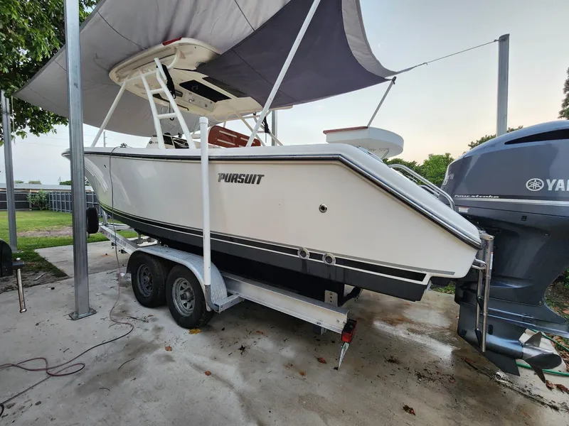 Slide: The Image of 2011 Pursuit S 280 Sport boat on trailer with Yamaha engines. - 2