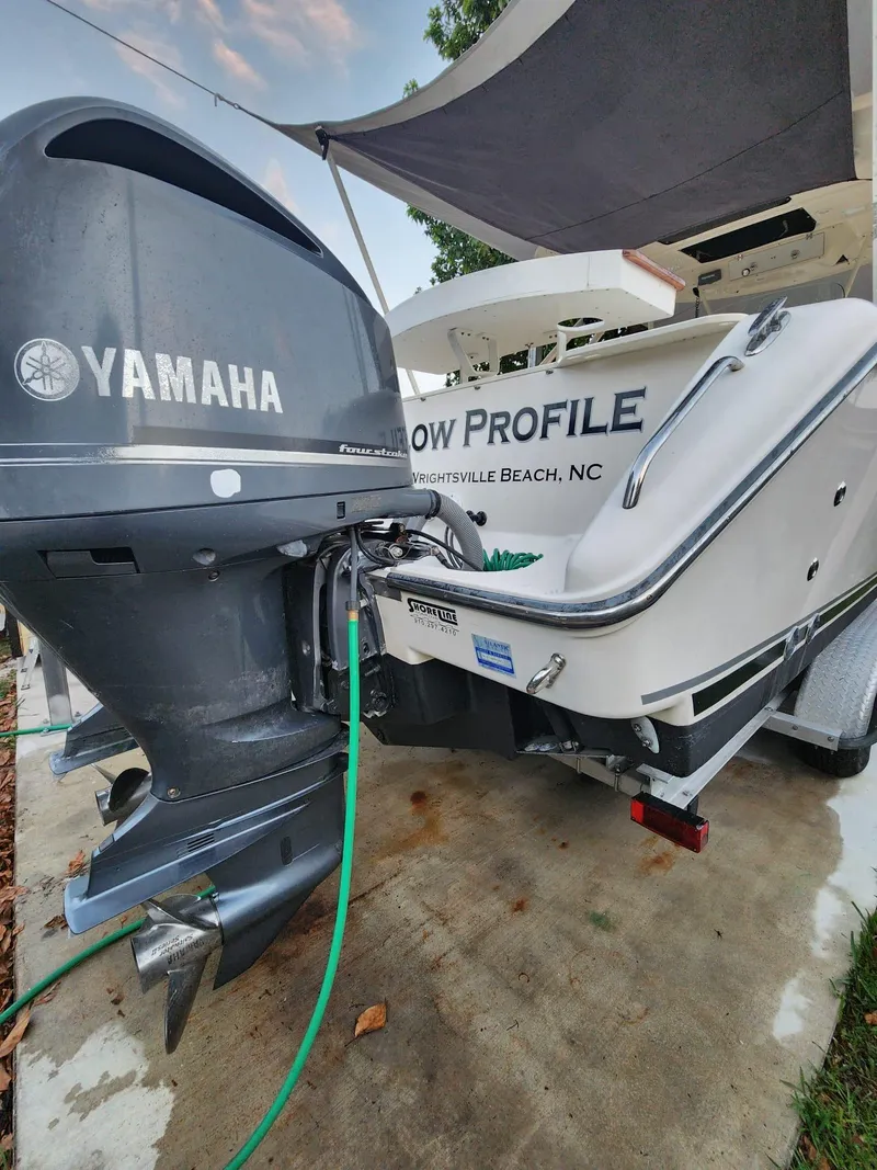 Slide: The Image of 2011 Pursuit S 280 Sport boat with Yamaha engine, parked on a trailer. - 4