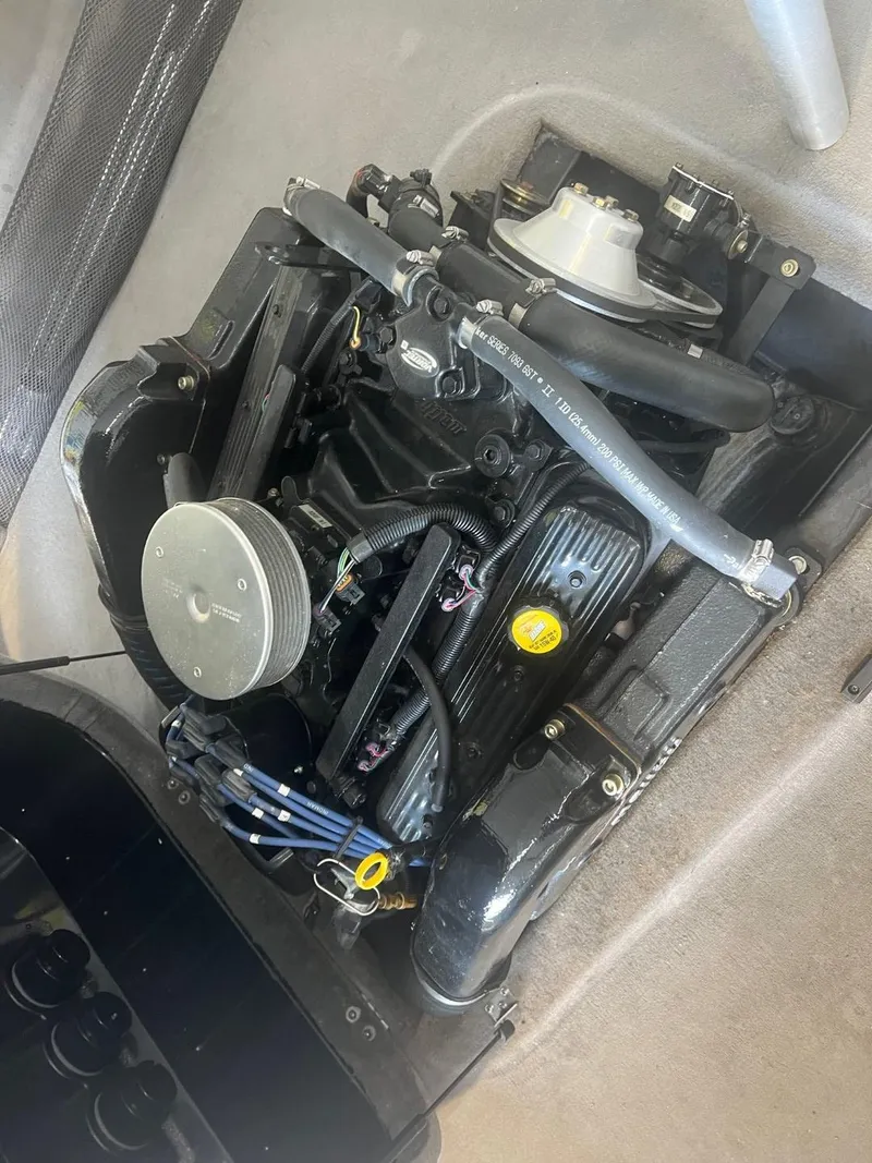 Slide: The Image of 2004 Malibu 20 Response LXI engine compartment, showcasing detailed components and layout. - 12