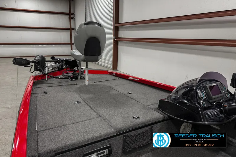 Slide: The Image of 2018 Triton 18 TX fishing boat interior with seating and control panel. - 21