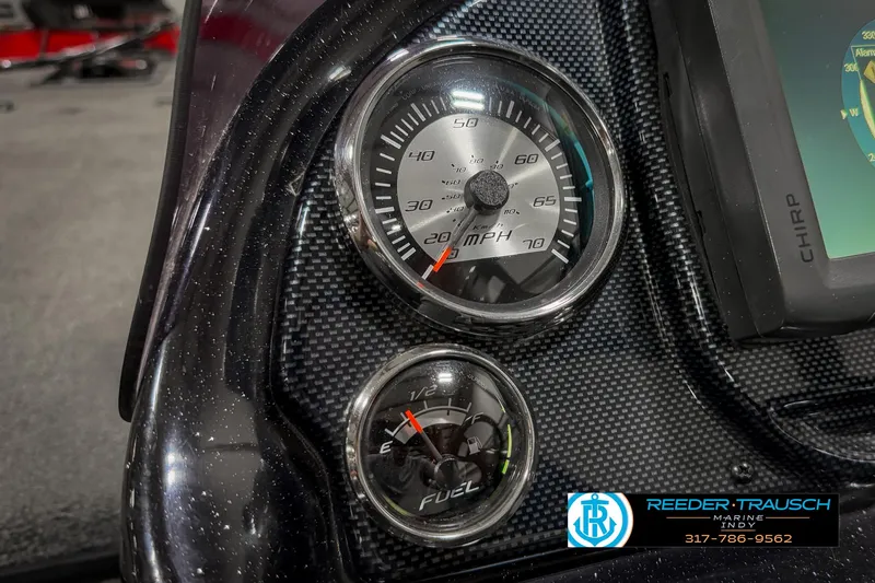 Slide: The Image of Dashboard of 2018 Triton 18 TX boat with speedometer and fuel gauge. - 30