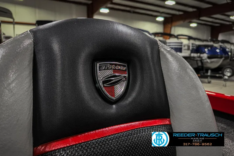 Slide: The Image of 2018 Triton 18 TX boat seat with logo in showroom. - 37