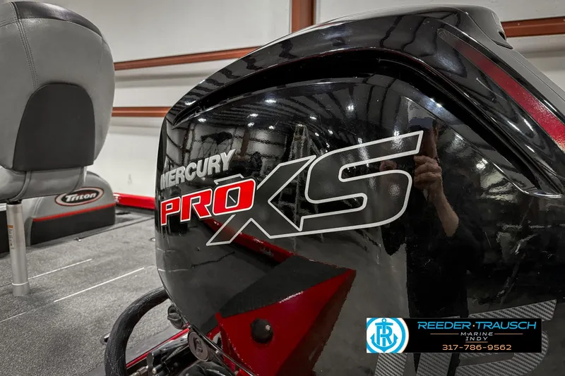 Slide: The Image of 2018 Triton 18 TX boat with Mercury Pro XS engine in showroom. - 47