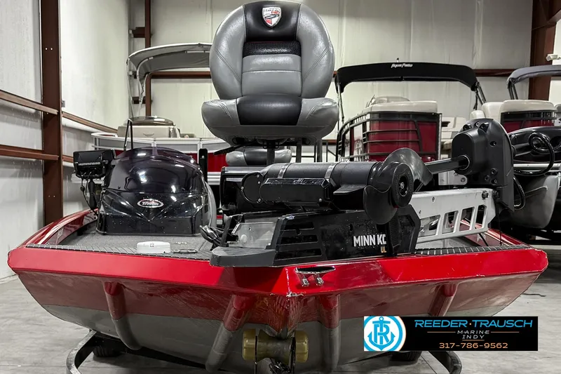 Slide: The Image of 2018 Triton 18 TX boat with Minn Kota motor in showroom. - 6