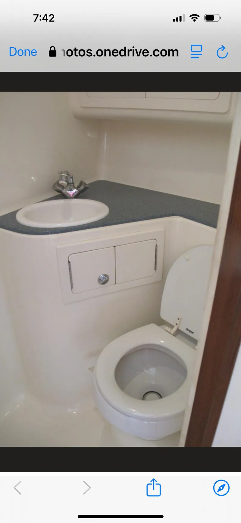 Slide: The Image of 2006 Carolina Classic 35 boat bathroom with sink and toilet. - 14