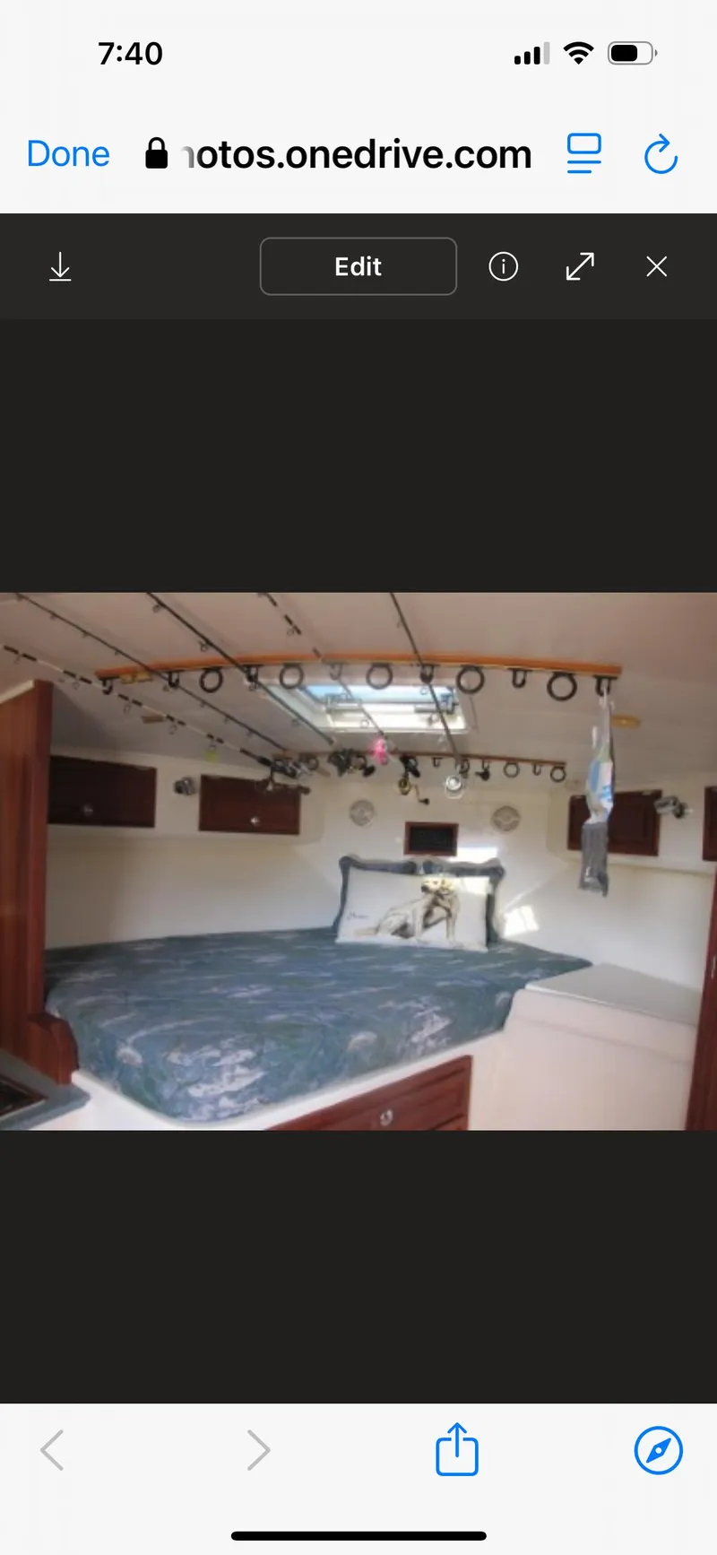 Slide: The Image of Interior cabin of a 2006 Carolina Classic 35 boat with a bed and portholes. - 21