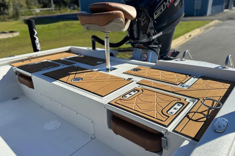 Slide: The Image of 2026 Avid 23 Fusion boat interior with stylish seating and storage compartments. - 11