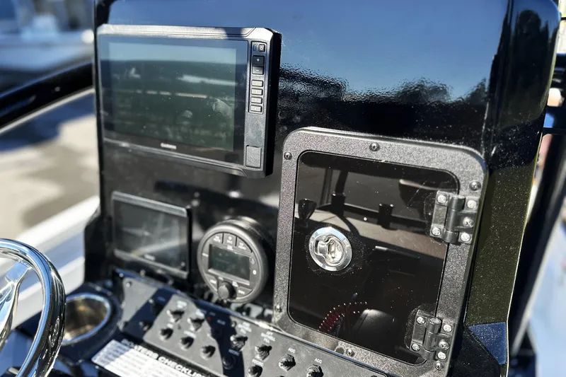 Slide: The Image of Control panel of 2026 Avid 23 Fusion boat with navigation screens and gauges. - 12