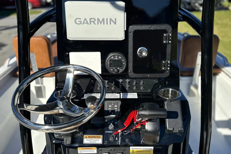 Slide: The Image of Steering console of 2026 Avid 23 Fusion boat with Garmin navigation system. - 17