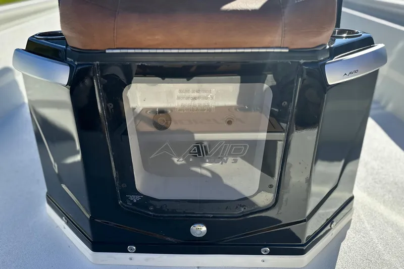 Slide: The Image of 2026 Avid 23 Fusion boat console with sleek black design and branding. - 20