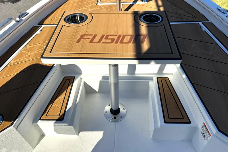 Slide: The Image of Avid 23 Fusion 2026 boat interior with wooden table and cup holders. - 28