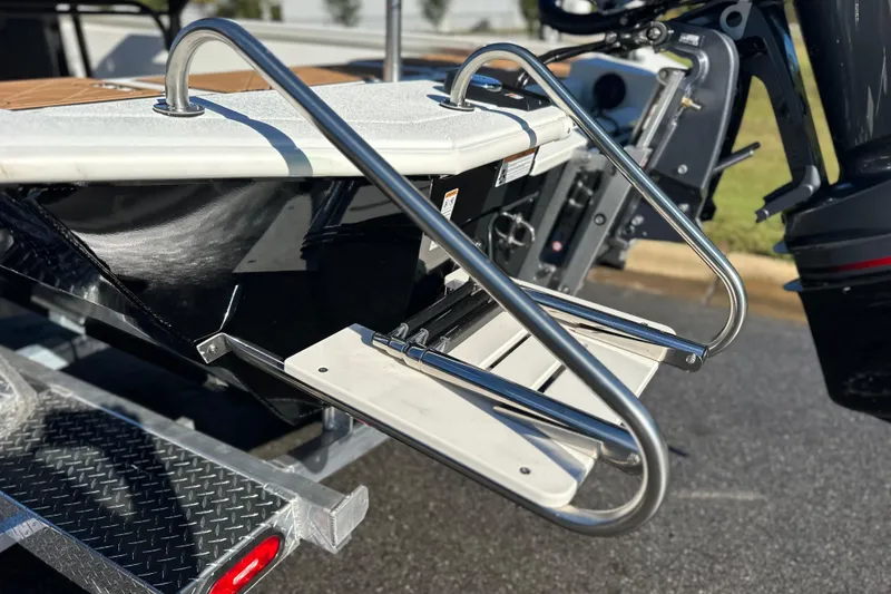 Slide: The Image of Avid 23 Fusion 2026 boat with stainless steel swim ladder on trailer. - 33