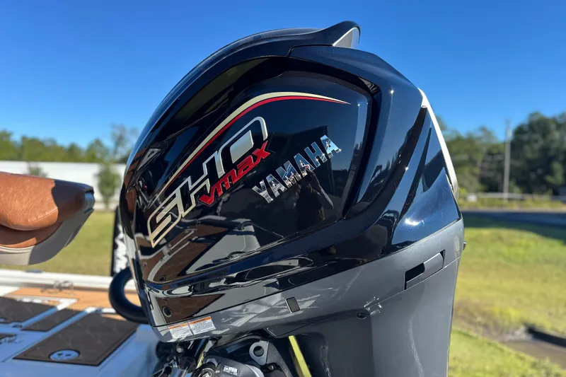 Slide: The Image of Yamaha SHO VMAX engine on 2026 Avid 23 Fusion boat, outdoors in sunny setting. - 35