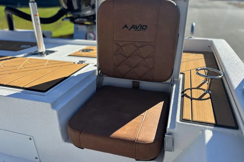 Slide: The Image of Brown leather seat on 2026 Avid 23 Fusion boat with cup holder. - 9