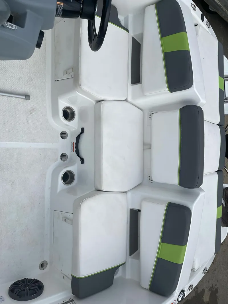 Slide: The Image of 2021 Tahoe T18 boat interior with gray and green seating. - 11