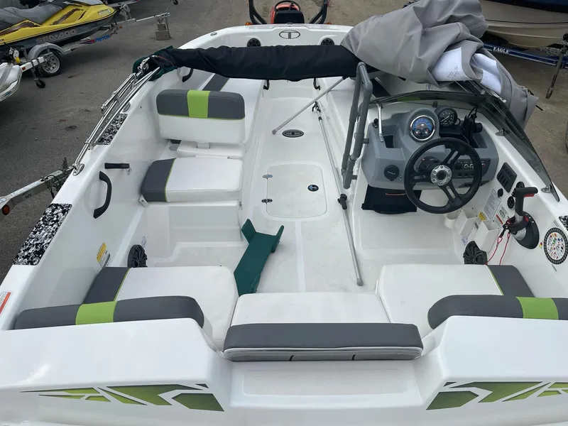Slide: The Image of 2021 Tahoe T18 boat interior with seating and steering wheel. - 12