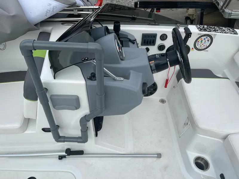 Slide: The Image of 2021 Tahoe T18 boat cockpit with steering wheel and control panel. - 19