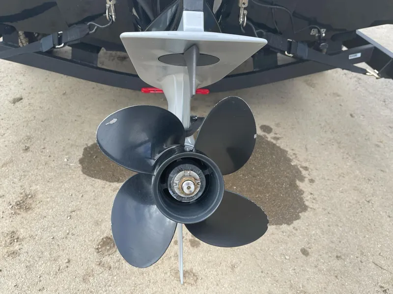 Slide: The Image of 2021 Tahoe T18 boat propeller on a trailer, close-up view. - 22