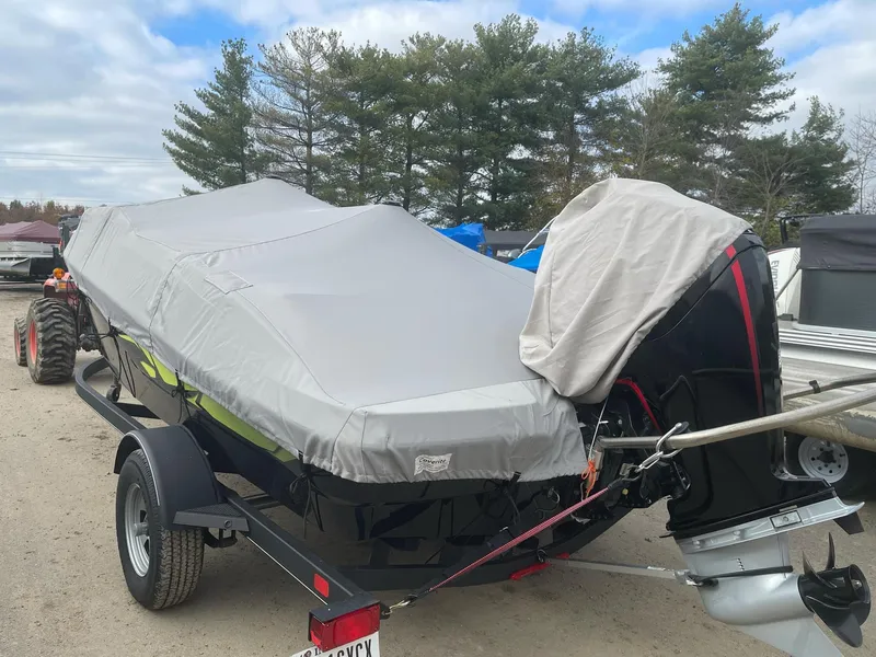 Slide: The Image of Covered 2021 Tahoe T18 boat on trailer in outdoor setting. - 8