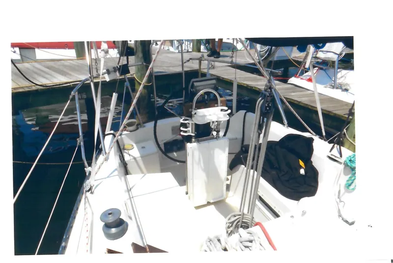 Slide: The Image of 1983 C&C 29 MkII sailboat cockpit with steering wheel and rigging at dock. - 4