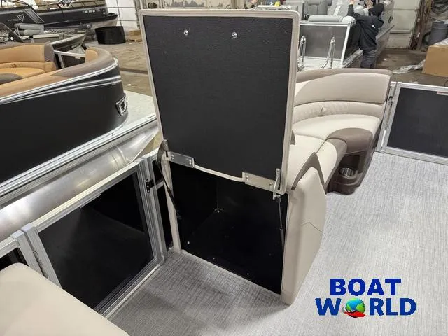 Slide: The Image of 2025 Tahoe LTZ 2385 Swingback interior with storage compartment, featuring beige seating. - 30