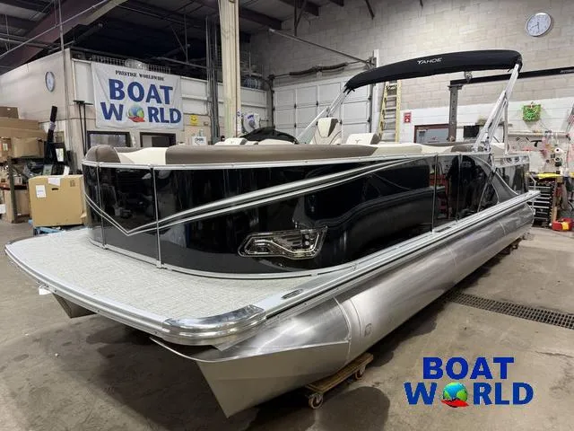 Slide: The Image of 2025 Tahoe LTZ 2385 Swingback pontoon boat in showroom, featuring Honda 4-Stroke EFI engine. - 39