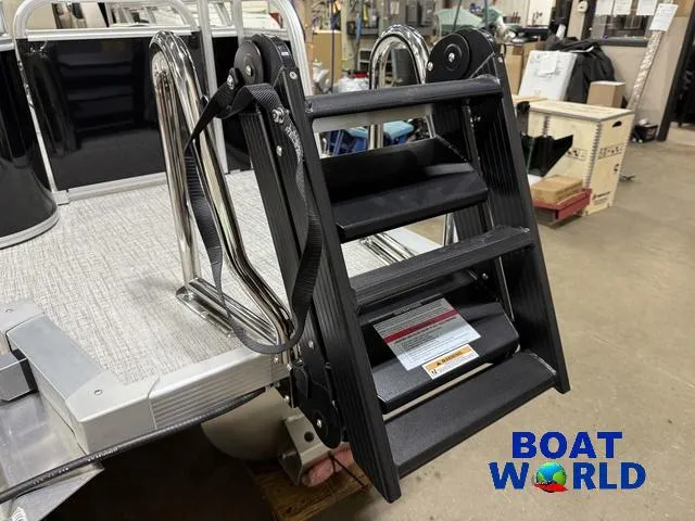 Slide: The Image of 2025 Tahoe LTZ 2385 Swingback boat ladder in showroom, featuring Honda 4-Stroke EFI. - 46