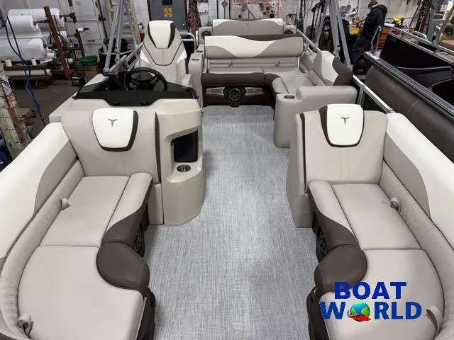 Slide: The Image of 2025 Tahoe LTZ 2385 Swingback interior with luxurious seating, showcased at Boat World. - 7