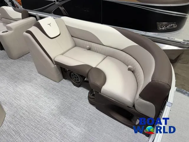 Slide: The Image of 2025 Tahoe LTZ 2385 Swingback boat interior with plush seating, Boat World logo. - 9