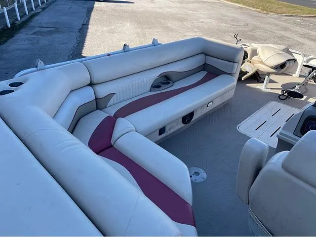 Slide: The Image of 2009 G3 LX 322FC boat interior with beige and maroon seating. - 11