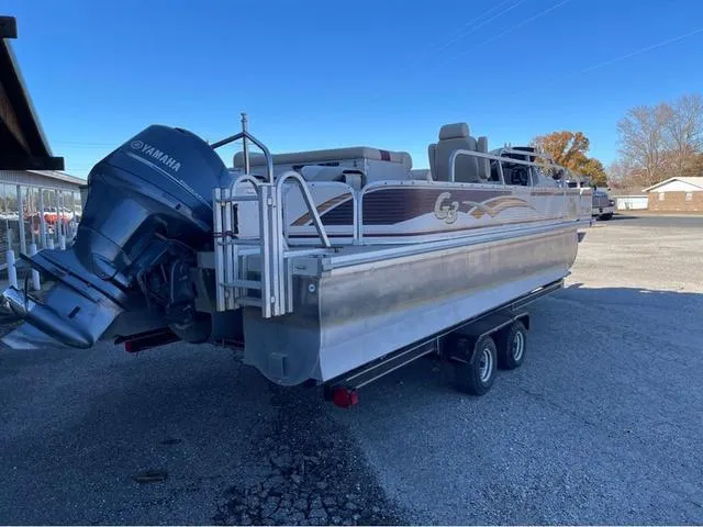 Slide: The Image of 2009 G3 LX 322FC pontoon boat with Yamaha motor on trailer. - 3