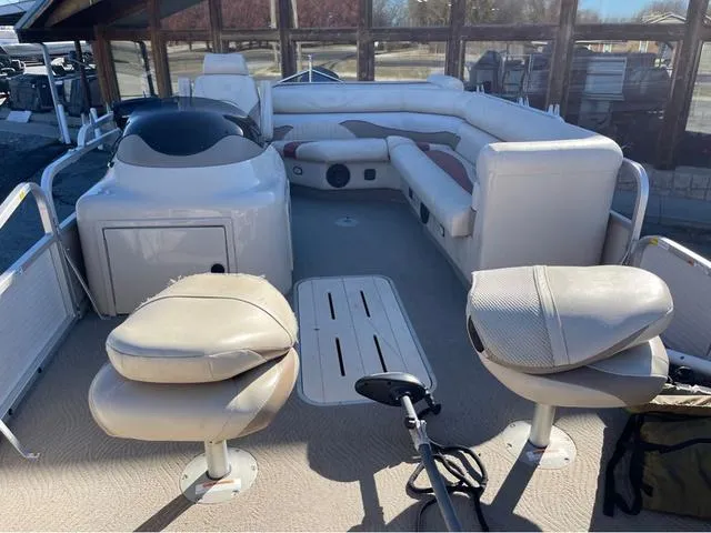 Slide: The Image of 2009 G3 LX 322FC pontoon boat interior with seating and helm. - 5