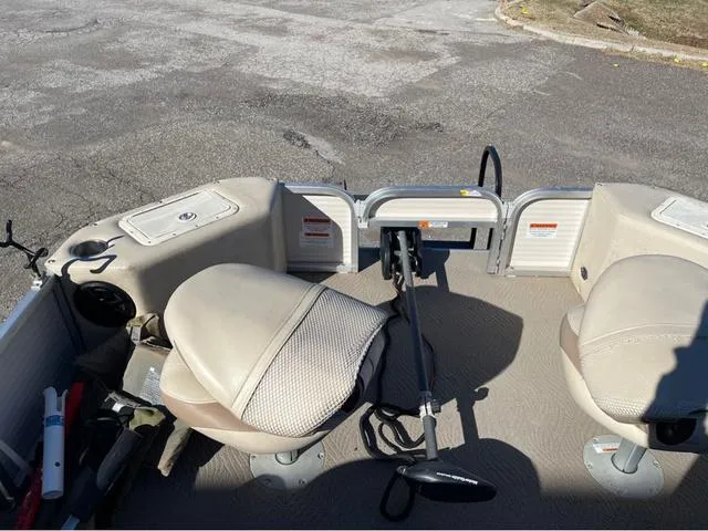 Slide: The Image of 2009 G3 LX 322FC boat interior with beige seats and steering wheel. - 6