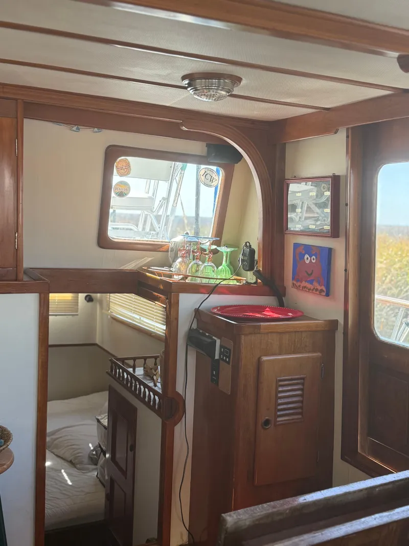 Slide: The Image of 1979 Marine Trader Double Cabin interior with wood paneling and nautical decor. - 15