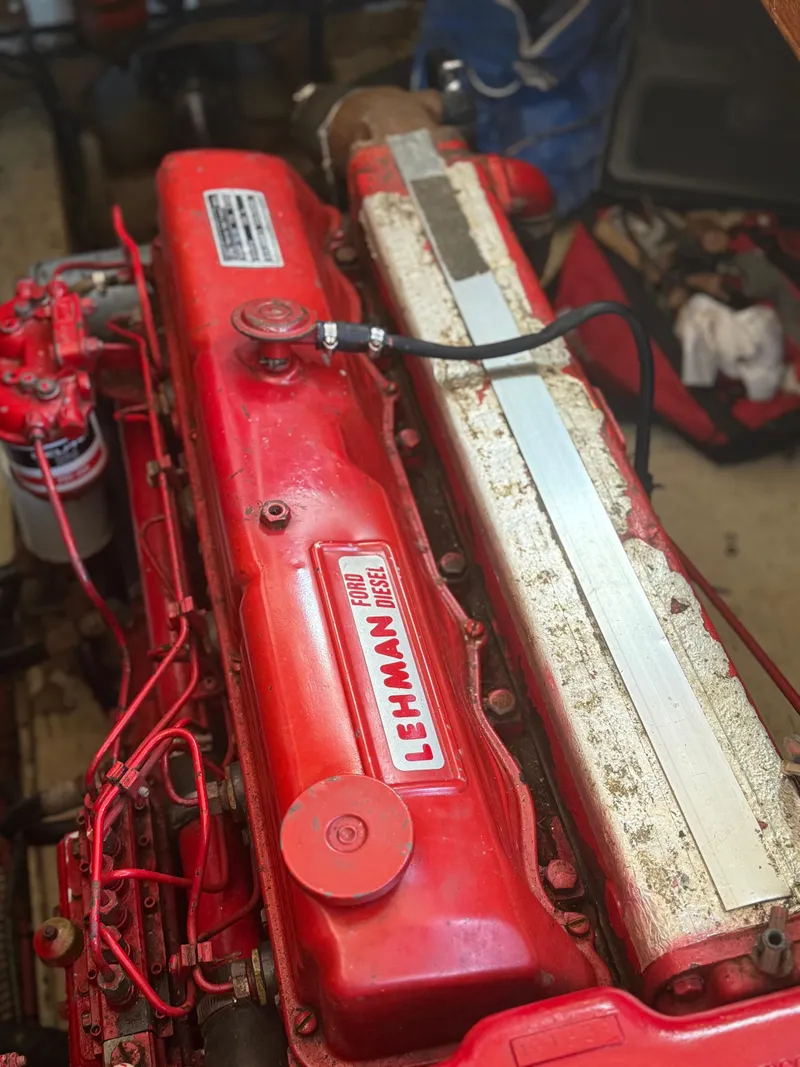 Slide: The Image of 1979 Marine Trader Double Cabin engine, Lehman diesel, red and silver components. - 18