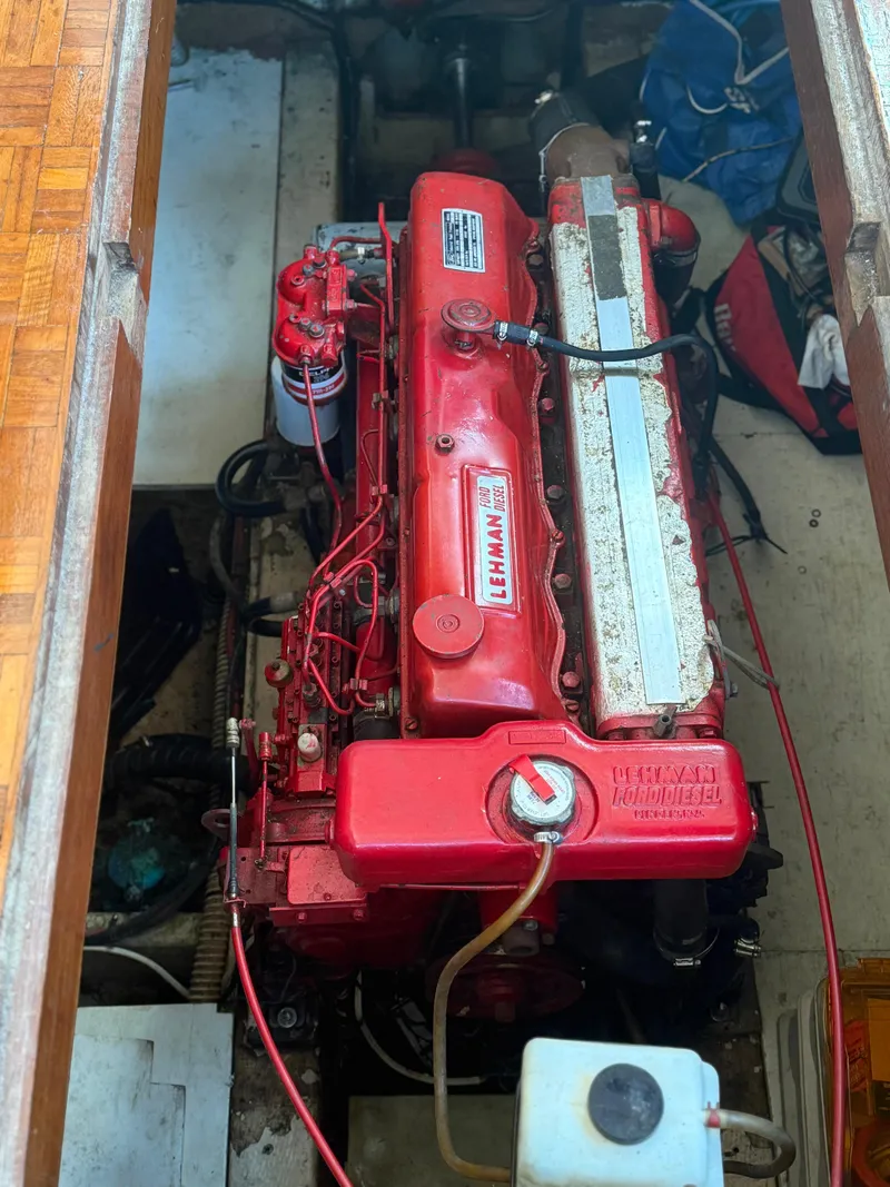 Slide: The Image of 1979 Marine Trader Double Cabin engine, red Lehman diesel, in boat interior. - 19