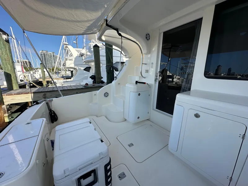 Slide: The Image of 2007 Silverton 38 Convertible yacht interior with docked boats in background. - 10