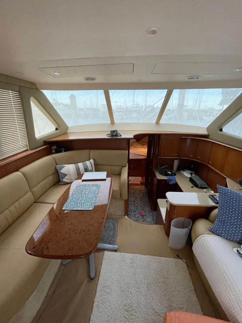 Slide: The Image of Luxurious interior of 2007 Silverton 38 Convertible yacht with plush seating and elegant design. - 18