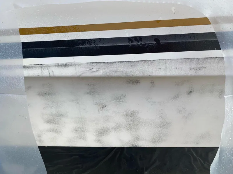Slide: The Image of Close-up of 2007 Silverton 38 Convertible boat hull with stripes. - 19