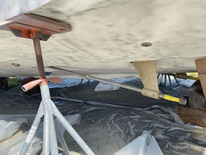 Slide: The Image of 2007 Silverton 38 Convertible boat under maintenance, supported by stands. - 25