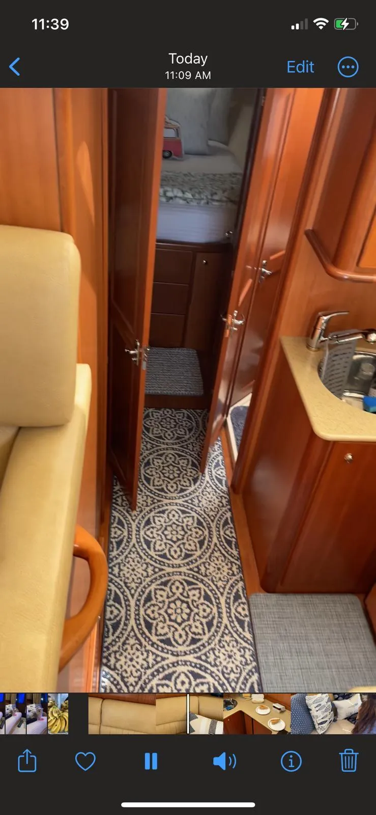 Slide: The Image of Interior of 2007 Silverton 38 Convertible yacht with wood finish and patterned flooring. - 5