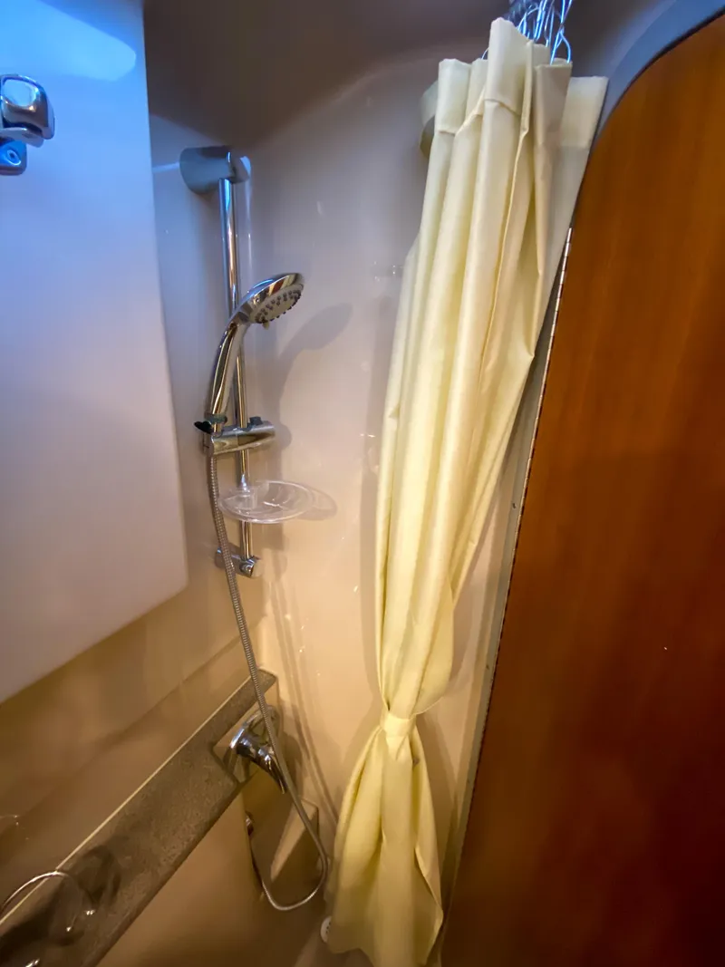 Slide: The Image of 2017 Ranger Tugs R-29 CB shower with curtain and chrome fixtures. - 22