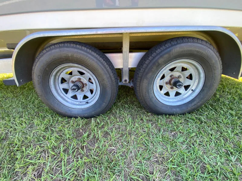 Slide: The Image of Trailer wheels of a 2018 Tidewater 2400 Bay Max on grass. - 12
