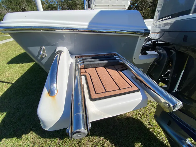 Slide: The Image of 2018 Tidewater 2400 Bay Max boat with stainless steel swim platform and ladder. - 14