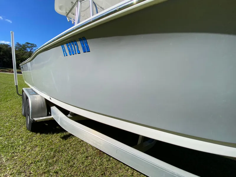 Slide: The Image of 2018 Tidewater 2400 Bay Max boat on trailer, side view, outdoors. - 21