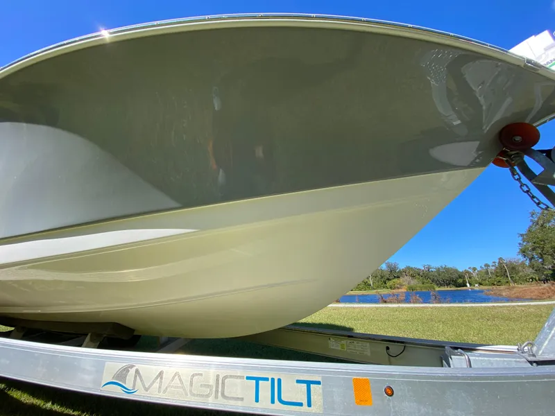 Slide: The Image of 2018 Tidewater 2400 Bay Max boat on Magic Tilt trailer, side view. - 22